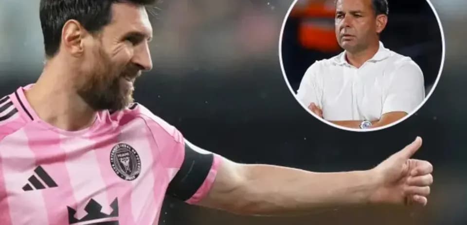 Lionel Messi gesturing during a match with coach visible