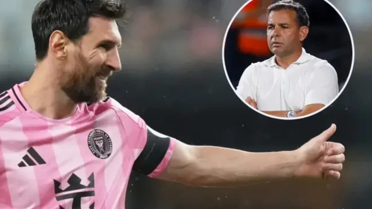 Lionel Messi gesturing during a match with coach visible