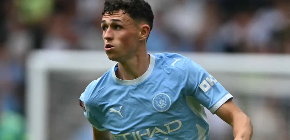 Jugador de Manchester City corriendo en el campo