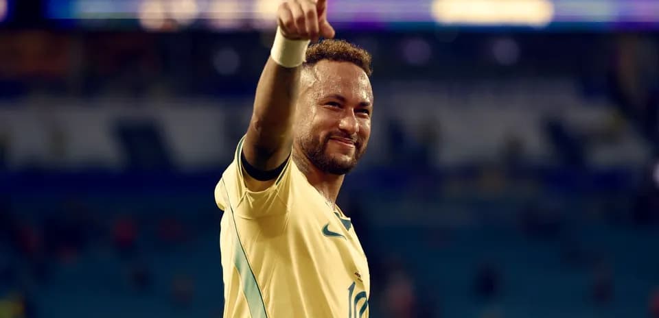 Jugador de fútbol celebrando con el dedo apuntando arriba