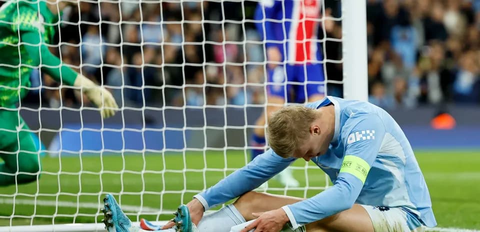 Jugador sentado en el campo tras un fallo