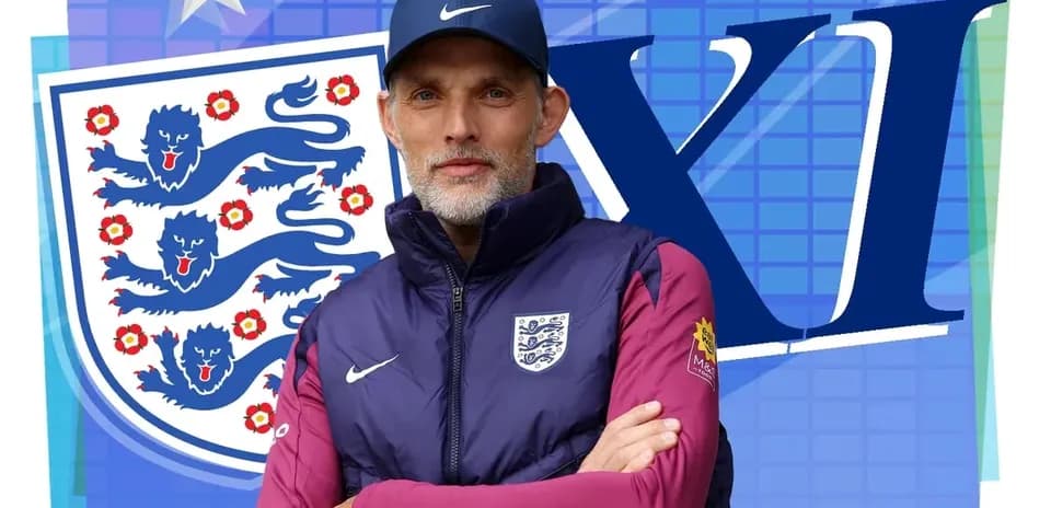 Entrenador posando frente al escudo de Inglaterra