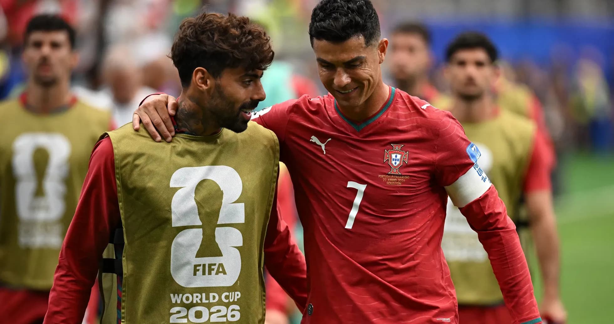 Cristiano Ronaldo conversing with teammate on field