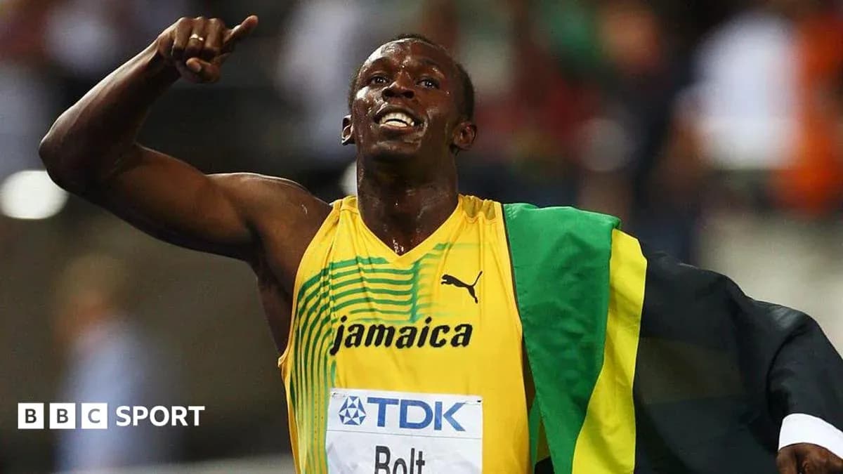 Atleta celebrando con bandera de Jamaica en competencia Atleta celebrando con bandera de Jamaica en competencia