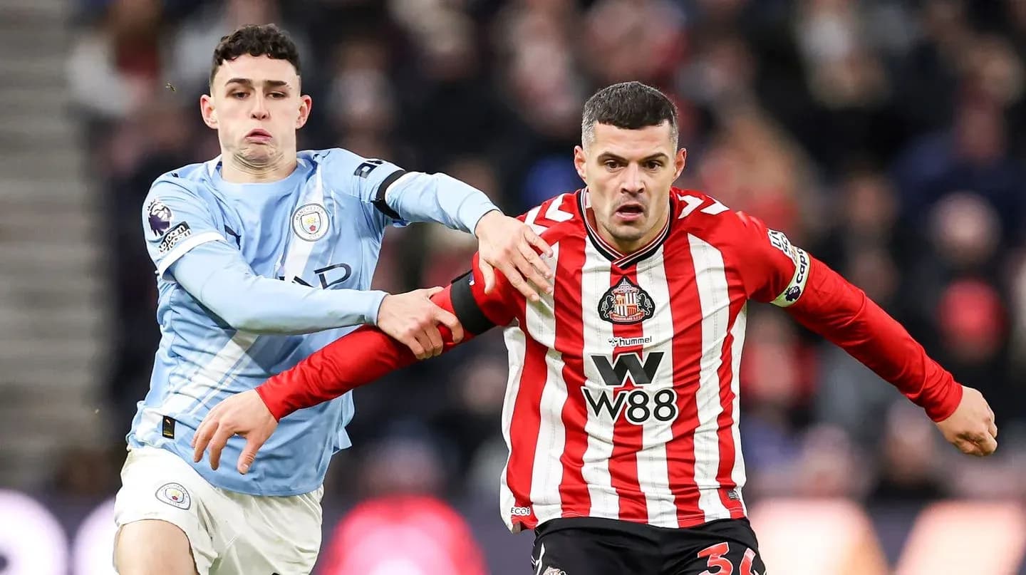 Jugadores de Manchester City y Sunderland en acción Jugadores de Manchester City y Sunderland en acción