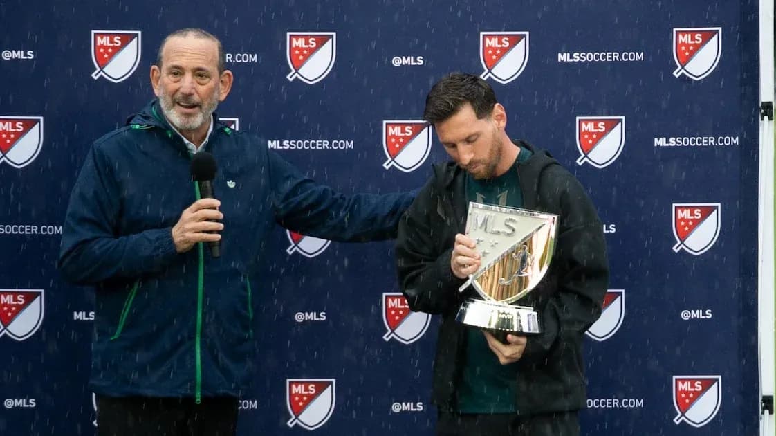 Lionel Messi holding trophy during MLS presentation Lionel Messi holding trophy during MLS presentation