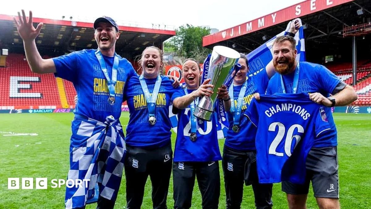 Celebrating team holding trophy and wearing medals Celebrating team holding trophy and wearing medals